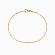 The 14K Yellow Gold Bead Bracelet features a delicate gold chain and small round clasp, shown on a plain white background.
