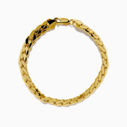 The 14K Yellow Gold Hollow Cuban Chain Bracelet features a flat curb link design and lobster clasp, displayed in a circular shape on a white background.