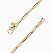 The 14K Yellow Gold Hollow Paperclip Chain Bracelet features elongated chain links and a small round charm near the clasp, shown on a white background.