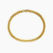 The Mens 14K Yellow Gold 4.5mm Solid Cuban Domed 9 Bracelet is shown in a circular shape, highlighting its domed curb link design and lobster clasp on a plain white background.