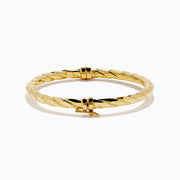 A 14K Yellow Gold Hammered Hinge Bangle featuring a textured finish, showcased on a white background.