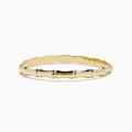 The 14K Yellow Gold Bamboo Hinge Bangle features a polished, bamboo-inspired texture and is photographed on a white background.