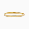 The 14K Yellow Gold Hollow Hinge Bracelet features a polished finish with subtle textured detailing along the edge, shown on a white background.