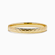 The 14K Yellow Gold Textured Hinge Bracelet features a shiny finish and a geometric diamond-patterned texture around its outer surface, shown on a white background.