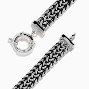 The Men's 925 Sterling Silver Chain-Link Diamond Bracelet features a woven silver design, a rectangular diamond-studded centerpiece, and a round clasp, displayed on a white background.