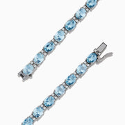 The Aquarius 14K White Gold Aquamarine Tennis Bracelet 8.23 TCW showcases a continuous row of round, light blue aquamarines in individual prong settings for timeless elegance.