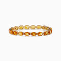 The Sunset 14K Yellow Gold Citrine Tennis Bracelet 19.15 TCW features round, faceted yellow and orange gemstones in an alternating pattern, shown on a white background.