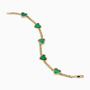 The 14K Yellow Gold Malachite and Diamond 5 Motif Heart Bracelet features five green malachite heart charms, each bordered by diamond-accented stones, evenly spaced along a yellow gold chain with a secure clasp.