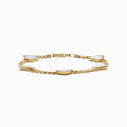 The 14K Yellow Gold Mother of Pearl and Diamond Heart Chain-link Station Bracelet features five white heart-shaped charms bordered with sparkling stones, evenly spaced along a gold chain.