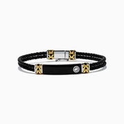 Mens 925 Sterling Silver and Leather Onyx Bracelet features black braided leather, gold and sterling silver accent clasps, a black rectangular plate, and a small round emblem on a white background.