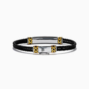 Mens 925 Sterling Silver and Leather Onyx Bracelet features black braided leather, gold and sterling silver accent clasps, a black rectangular plate, and a small round emblem on a white background.