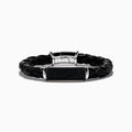 The Mens 925 Sterling Silver Spinel Leather Bracelet features black braided leather, a shiny sterling silver clasp, and a rectangular silver accent with sparkling black spinels, displayed against a white background.