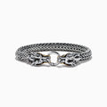 The Mens 925 Silver & 14K Yellow Gold Black Sapphire and Tsavorite Dragon Bracelet features two detailed dragon heads with black sapphire eyes, facing each other and joined by a round clasp.