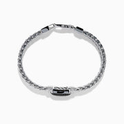 The Mens Sterling Silver Black Spinel Bracelet features a woven chain, a rectangular textured black spinel centerpiece, and a secure clasp closure, shown on a white background.