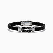 The Men's 925 Sterling Silver Black Spinel Leather Bracelet features black braided leather, sterling silver accents, and a decorative clasp with a black and silver loop design, displayed on a white background.