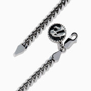 The 925 Mens Sterling Silver Curb Chain Link Bracelet features a lobster clasp and a small, round yin-yang charm, displayed on a white background.