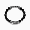 The Mens Sterling Silver Beaded Black Agate Bracelet features round black agate beads, sterling silver accents, a rectangular plate engraved with a starburst, and two cylindrical silver beads with star motifs near the clasp.