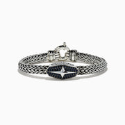 The 925 Sterling Silver and Black Spinel Braided Chain Bracelet features an oval clasp with a star design adorned with black spinels and a round spring ring closure.