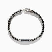 The Men's 925 Sterling Silver Black Spinel Chain-Link Bracelet features black and silver woven links, a rectangular clasp accented with black spinel stones, and a round spring-ring closure at the top.