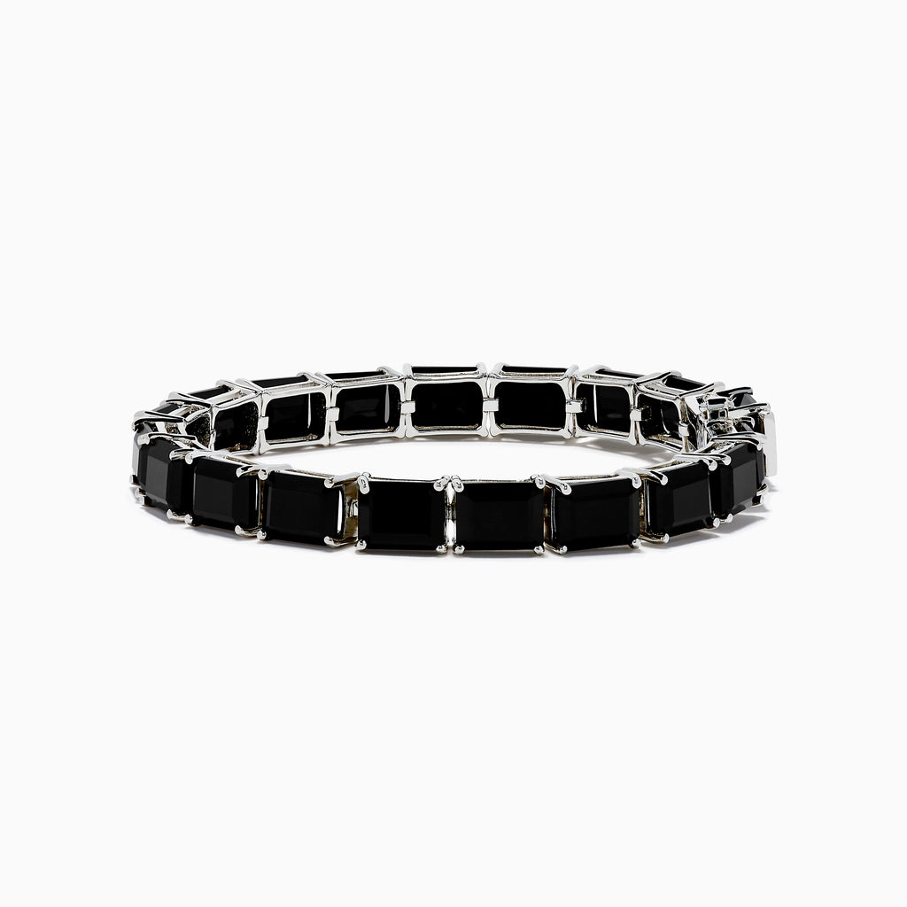 The 925 Sterling Silver Onyx Tennis Bracelet features rectangular black onyx stones in a sleek silver link design, shown on a white background—an elegant accessory for any occasion.