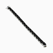 The 925 Sterling Silver Onyx Tennis Bracelet features rectangular black onyx stones in a sleek silver link design, shown on a white background—an elegant accessory for any occasion.