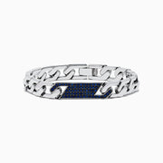 The 925 Sterling Silver Sapphire Bracelet features chain links and a rectangular centerpiece with small blue gemstones, evoking the look of sapphires, and is shown on a white background.
