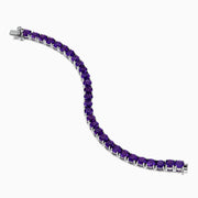 The 925 Sterling Silver Purple Amethyst Bracelet is shown on a plain white background, featuring faceted round amethyst gemstones in a classic tennis style.