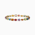 The Mosaic 14K Yellow Gold Multi Color Gemstone Bracelet features evenly spaced ovals, teardrops, and rectangles in vibrant hues along an elegant yellow gold band.