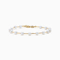 The 14K Yellow Gold Fresh Water Pearl Station Bracelet features a delicate design with evenly spaced pearls and a gold lobster clasp, displayed on a plain white background.