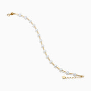 The 14K Yellow Gold Fresh Water Pearl Station Bracelet features a delicate design with evenly spaced pearls and a gold lobster clasp, displayed on a plain white background.