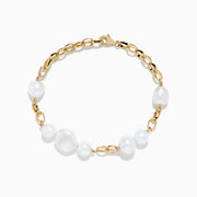 The 14K Yellow Gold Fresh Water Pearl Chain Link Bracelet features five irregular freshwater pearls evenly spaced on a delicate gold chain, finished with a secure lobster clasp.