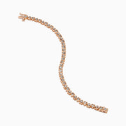 A Rose Plated Sterling Silver Diamond Hearts Tennis Bracelet, featuring alternating heart-shaped links with sparkling diamonds, is displayed against a white background.