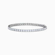 The Lab Grown Round Diamond 7.00ct Tennis Bracelet in 14K White Gold features a continuous row of prong-set lab grown diamonds and is displayed on a white background.