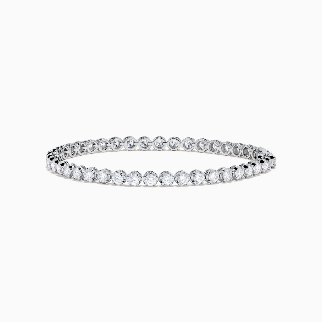 The Lab Grown Round Diamond 5.00ct Cupcake Setting Tennis Bracelet in 14K White Gold features a slender band adorned with a continuous row of sparkling lab grown diamonds.