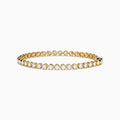 The Lab Grown Round Diamond 5.00ct Cupcake Setting Tennis Bracelet in 14K Yellow Gold features a single row of prong-set lab grown diamonds, shown against a white background.