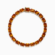 The Sunset 14K Yellow Gold Radiant Cut Citrine Tennis Bracelet showcases rectangular, faceted amber-hued gemstones in individual prong settings along a classic yellow gold chain.