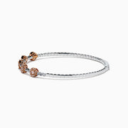 The 14K Two-Tone Gold Pink and White Diamond Flexible Bangle features round pink and white diamond clusters linked on a slender, polished band—a modern, refined update on the classic diamond bangle.