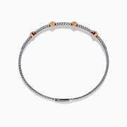 The 14K Two-Tone Gold Pink and White Diamond Bangle features a delicate band with pink and white diamonds, including five marquise-shaped pink diamond clusters set in rose gold.