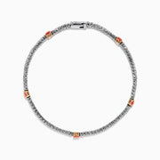 The Lab Grown Pink and White Diamond Tennis Station Bracelet in 14K White Gold features a slim band with sparkling clear stones and three larger pink and white diamonds in rose gold accents, beautifully displayed on a white background.