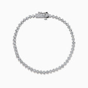 The 14K White Gold Diamond Miracle Setting Tennis Bracelet features a continuous line of round-cut diamonds set in white gold, displayed against a plain white background.