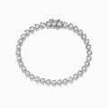 The Pave Classica 14K White Gold Diamond Bracelet features a single row of round, sparkling white diamonds in an oval shape, beautifully set against a white background.