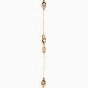 The Pave Rose 14K Rose Gold Diamond Station Bracelet features five round diamonds in gold bezels on a delicate chain with a lobster clasp, shown on a white background.