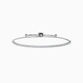 The 14K White Gold Pave Diamond Bolo Bracelet features a row of sparkling diamonds and a sliding clasp, elegantly displayed on a white background.