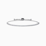 The 14K White Gold Pave Diamond Bolo Bracelet features a row of sparkling diamonds and a sliding clasp, elegantly displayed on a white background.