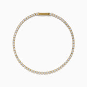 The 14K Yellow Gold Diamond Tennis Bracelet 2.33TCW, featuring a continuous row of sparkling round white diamonds, is elegantly shown on a simple white background.