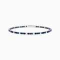 The Royale Bleu 14K White Gold Tennis Bracelet features alternating round blue sapphires and diamonds set in a slim band with a simple clasp, shown on a white background.