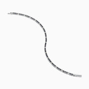 The Royale Bleu 14K White Gold Tennis Bracelet features alternating round blue sapphires and diamonds set in a slim band with a simple clasp, shown on a white background.