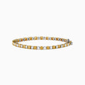 The Canare 18K White and Yellow Gold Diamond Tennis Bracelet features alternating white and yellow diamonds, elegantly displayed in a circular shape on a white background.