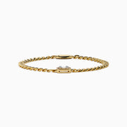 The D'Oro 14K Yellow Gold Diamond Bracelet features a rectangular diamond-accented centerpiece on a gold chain, bordered with additional gems and secured by a sleek cylindrical clasp.