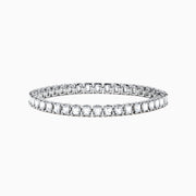 The 18K White Gold Diamond Tennis Bracelet features a continuous row of square-cut diamonds in an elegant design set against a white background.